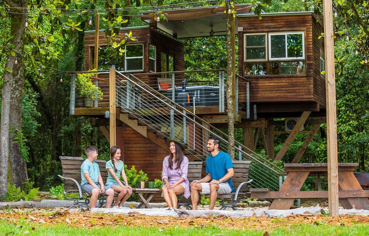 a family sitting on an outdoor patio