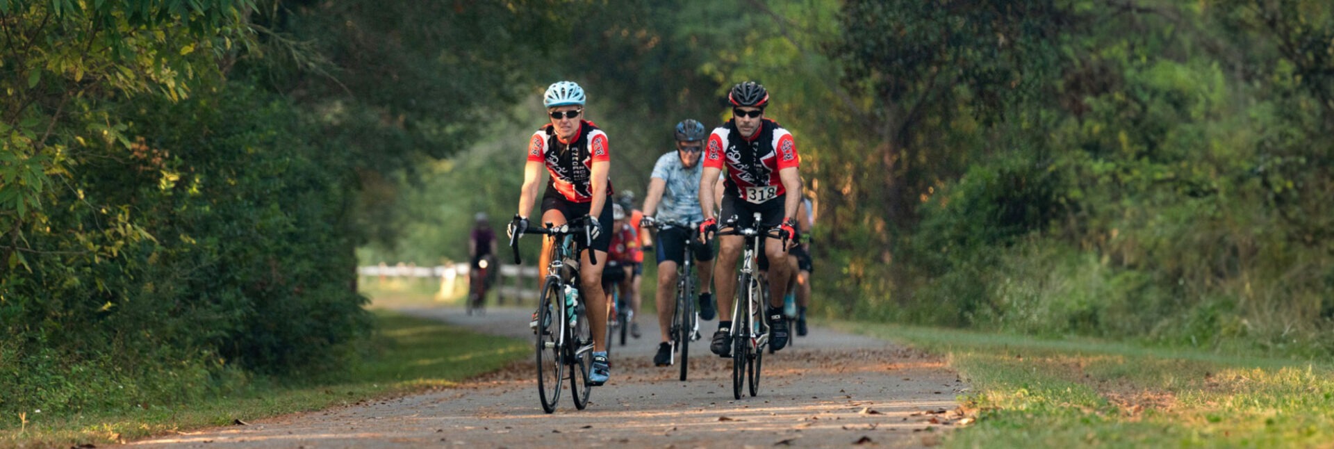 two cyclists on paved path