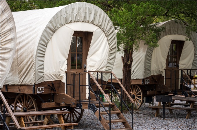 outside of a covered wagon with stairs to the entrance