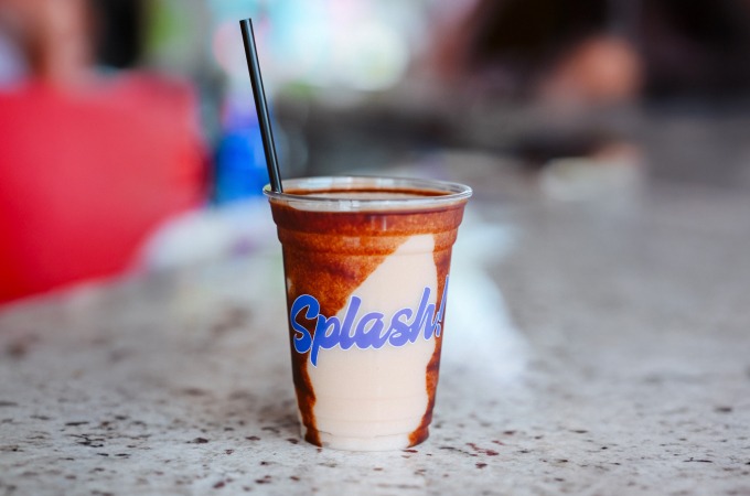 frozen tiki drink with Splash logo on the cup